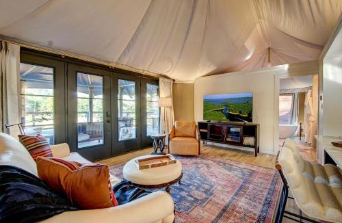 Mid America House | Hot Springs Retreat: Luxe Tented Cabin with Waterfront Views and Hot Tub