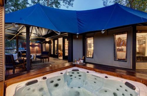 Mid America House | Hot Springs Retreat: Luxe Tented Cabin with Waterfront Views and Hot Tub