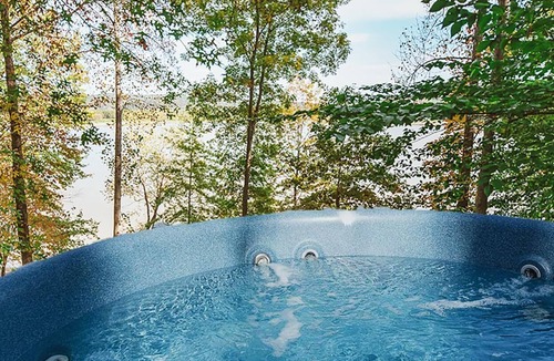 Heltonville Cabin | Hot tub overlooking Lake Monroe. Pet Friendly!