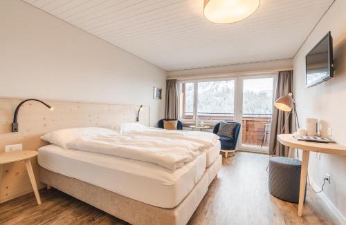 Arosa Hotel | Hotel Alpensonne - Panoramazimmer & Restaurant