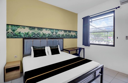 Sunset Road Hotel | Hotel O near Trans Studio Theme Park formerly Sunset Cozy