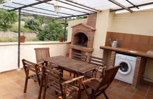 Beceite Apartment | House Ana III. Attic terrace and fireplace