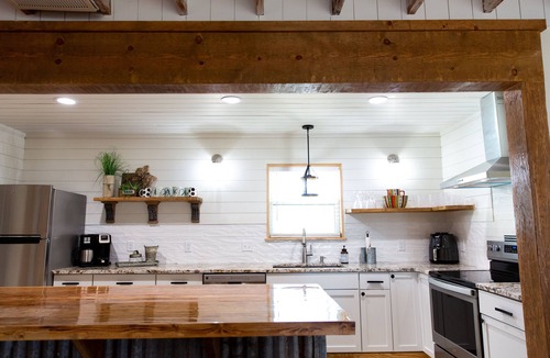 Checotah House | House on the lake with a large sandy beach just steps from the back door.