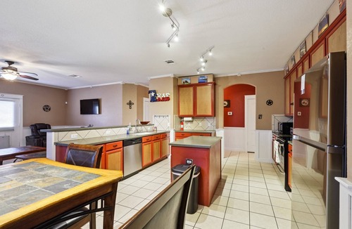 Hutto House | Huge Handicap Accessible Home Sleeps 21. Game Room, Office, Stocked Kitchen with so many TVs