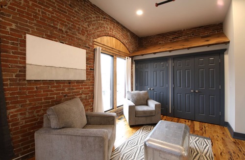 Glens Falls Apartment | Huge Windows Downtown 2Bd Apt w/Main Strip Access