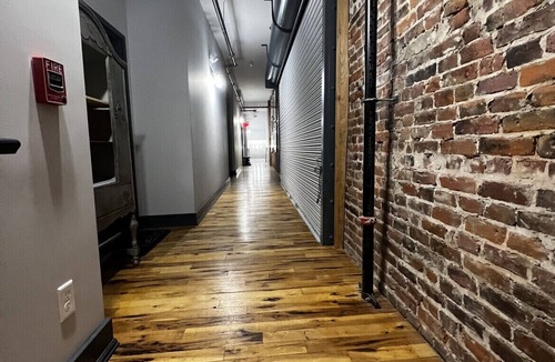 Glens Falls Apartment | Huge Windows Downtown 2Bd Apt w/Main Strip Access