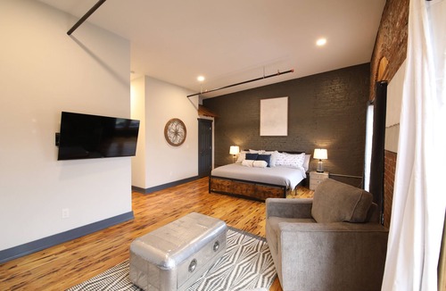 Glens Falls Apartment | Huge Windows Downtown 2Bd Apt w/Main Strip Access