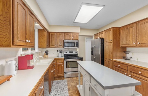 Holland House | Ideal Lakeshore location in serene wooded landscape with waterfalls.
