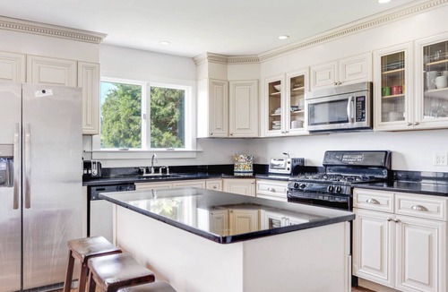 Westhampton Beach House | Idyllic traditional home with spacious rooms, fenced yard, and private pool.