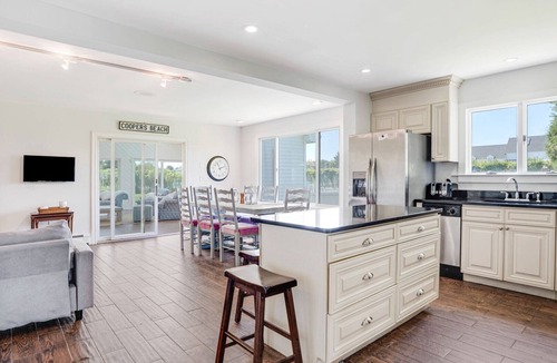 Westhampton Beach House | Idyllic traditional home with spacious rooms, fenced yard, and private pool.