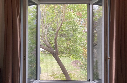 Nebias House | In a garden facing the mountains, a charming little house for 2 people