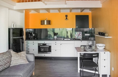 Mirandol-Bourgnounac House | In idyllic location of a forest and near the river Vaur is this cozy wooden house.