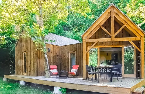Mirandol-Bourgnounac House | In idyllic location of a forest and near the river Vaur is this cozy wooden house.