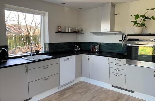 Rageleje House | In the charming coastal town of Rågeleje, this lovely holiday home is located.