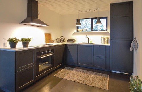 Faxe Ladeplads House | In the first row to the water lies the cozy cottage.
