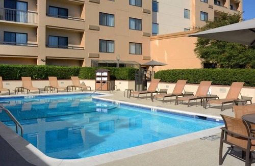 North Dallas Hotel | Indulge in Home-Like Comfort! Outdoor Pool, Pet-friendly and Parking!