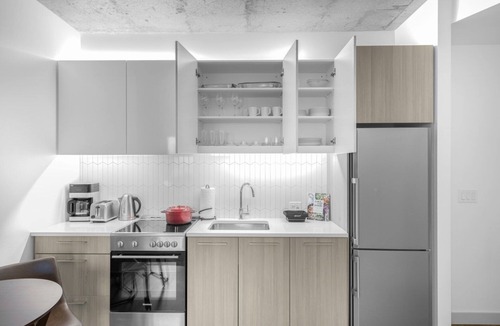 MIT Apartment | Industrial 1BR near MIT w/Gym, Doorman, Roof Deck