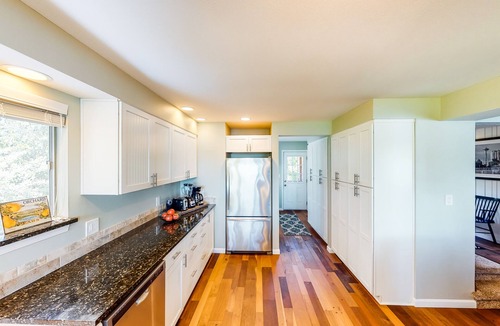 Poulsbo House | Inviting bayside dwelling with beach access, deck, waterfront views, & fireplace