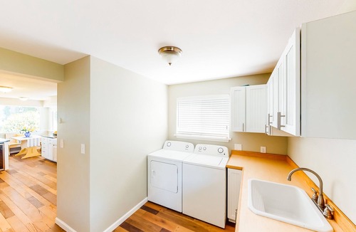 Poulsbo House | Inviting bayside dwelling with beach access, deck, waterfront views, & fireplace