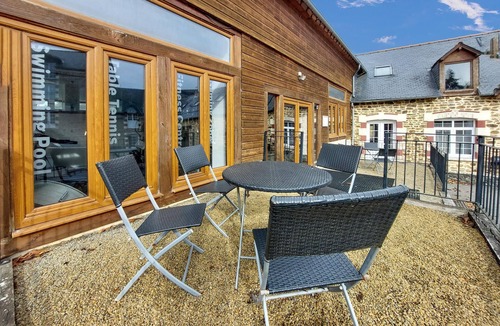 Desertines House | Inviting cottage with indoor community pool and activity room.