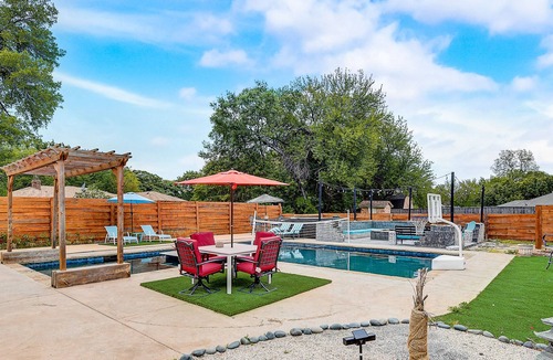 Sachse House | Inviting dog-friendly home with pool, full kitchen, central AC, & W/D