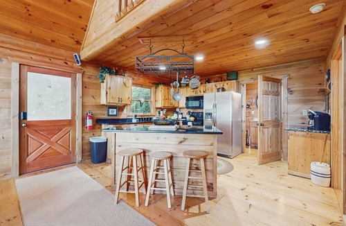 Walnut Mountain Cabin | Inviting forest cabin with pool access & picture windows