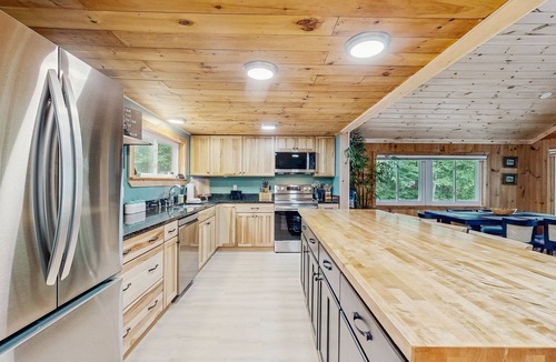 South Casco House | Inviting lakefront home with private dock, sandy beach, and stunning views