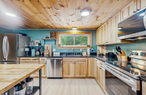 South Casco House | Inviting lakefront home with private dock, sandy beach, and stunning views