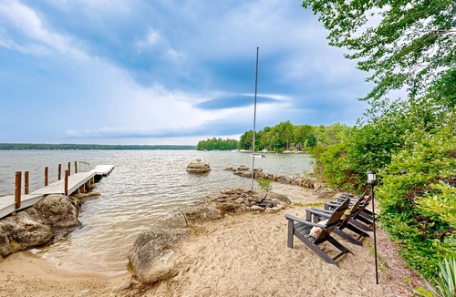 South Casco House | Inviting lakefront home with private dock, sandy beach, and stunning views