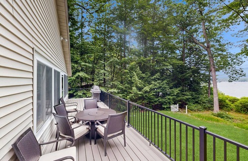 South Casco House | Inviting lakefront home with private dock, sandy beach, and stunning views