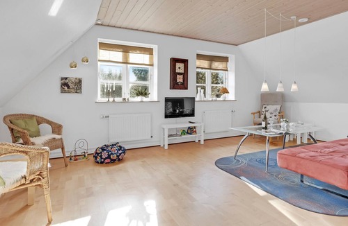 Sabro Apartment | Inviting vacation home with wood stove and grounds, located in a cozy town outside Arhus.
