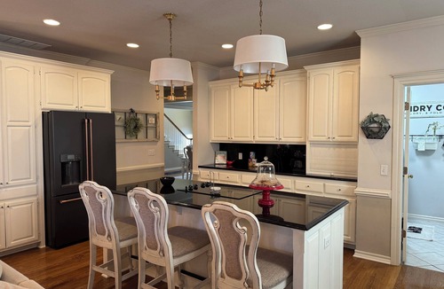 South Tulsa House | King Room w/ensuite downstairs. 3 Q rooms and full bath upstairs. Luxury kitchen w/giant island, wine cabinet w/sink, Breakfast Rm seats 6. Dining Rm seats 8. Half bath, Patio w/outdoor table, sofa and TV. In-ground pool, pool table, doggie door