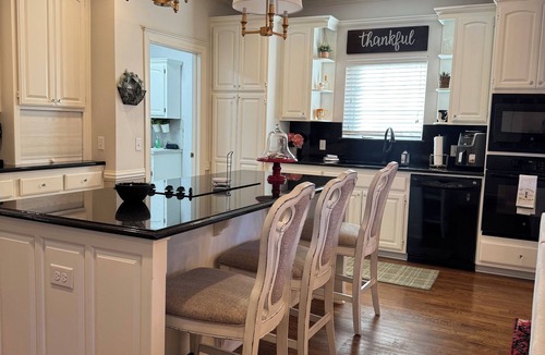 South Tulsa House | King Room w/ensuite downstairs. 3 Q rooms and full bath upstairs. Luxury kitchen w/giant island, wine cabinet w/sink, Breakfast Rm seats 6. Dining Rm seats 8. Half bath, Patio w/outdoor table, sofa and TV. In-ground pool, pool table, doggie door