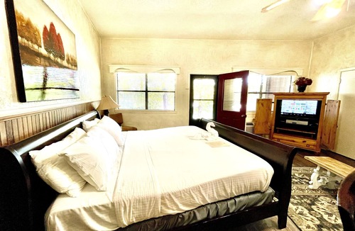 Mount Ida Cabin | King Studio with king bed, dining area, sleeper sofa and view of Lake Ouachita by RedAwning