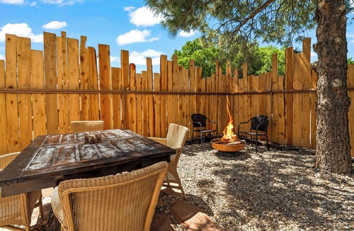 Taos House | King Suite, kitchenette, private fenced patio with shared laundry and sauna on site.