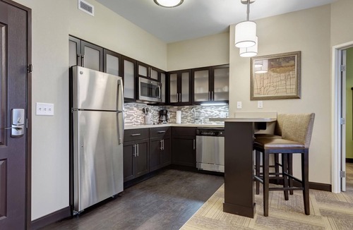 Maryland Heights Condo | King Suite Near Edward Jones! Shared BBQ Area On-Site