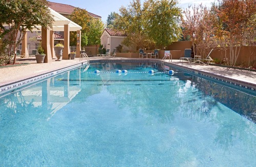 Tech Terrace Condo | King Suite. Shared Pool & Hot Tub. Free Breakfast. Near Texas Tech University & University Medical Center.