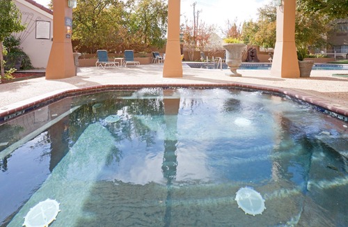 Tech Terrace Condo | King Suite. Shared Pool & Hot Tub. Free Breakfast. Near Texas Tech University & University Medical Center.