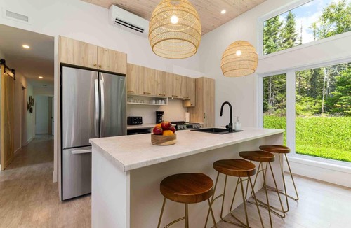 Baie-St-Paul Ski Chalet | La Charlebois 24: Forest Views, Hot Tub & Patio