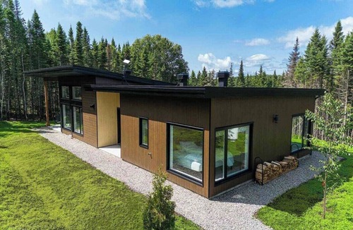 Baie-St-Paul Ski Chalet | La Charlebois 24: Forest Views, Hot Tub & Patio