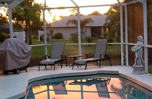 Pebble Beach House | La dolce vita awaits in this immaculate pool home on fresh water canal.