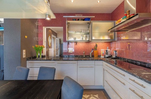 Huenibach Villa | Lake and Mountain View Villa with Hot Tub & Garden
