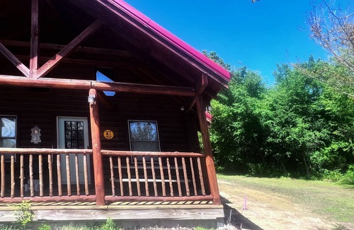 Checotah Cabin | Lake Eufaula Log Cabin with Hot Tub + WiFi