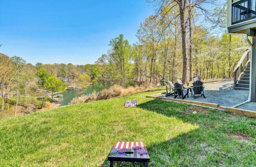 High Point House | Lake-It- Easy- Pet-friendly home with sunrise views. E enjoy the kayaks during the day and the firepit in the evening.