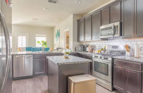 Missouri City House | Lake Olympia home seasonal pool, patio BBQ pit, & play area.
