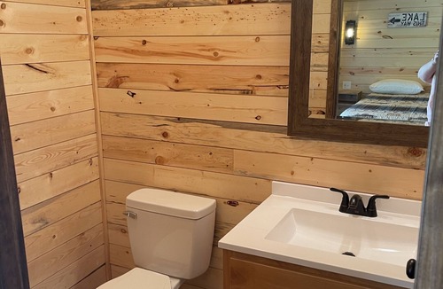 Grove Cabin | Lake view 2 bedroom cabin that sleeps 6. Private deck and fire pit area.