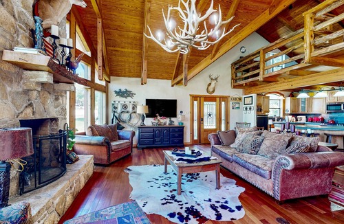 Whitney House | Lake view home with expansive yard, lovely porch & nearby lake access