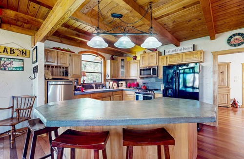 Whitney House | Lake view home with expansive yard, lovely porch & nearby lake access