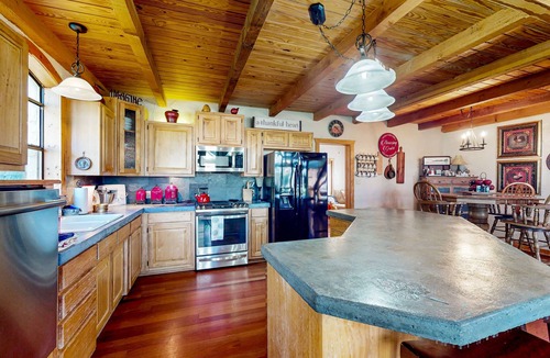 Whitney House | Lake view home with expansive yard, lovely porch & nearby lake access