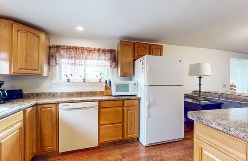 Cayuga House | Lake-view retreat with dock access, firepits, & large yard